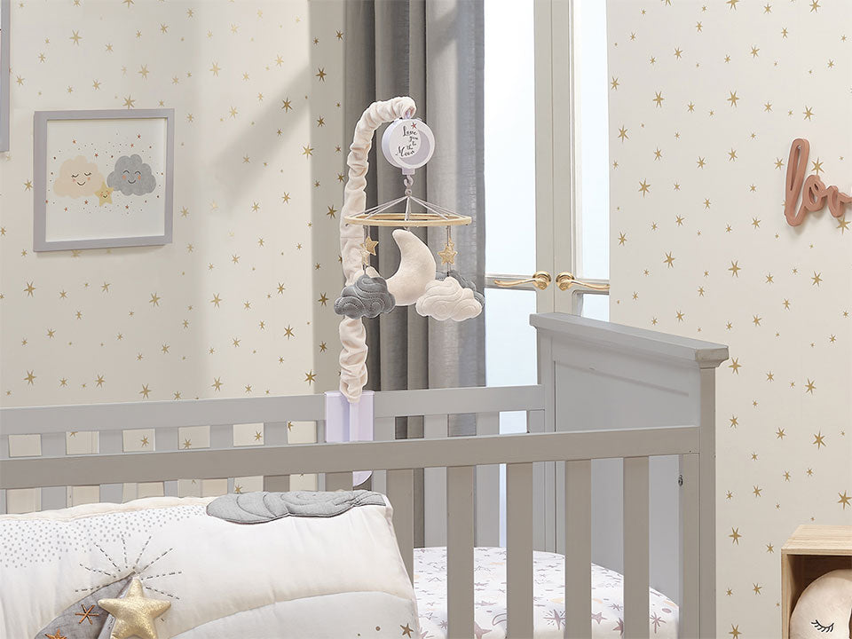 Goodnight Moon Crib Mobile hanging from crib in baby nursery