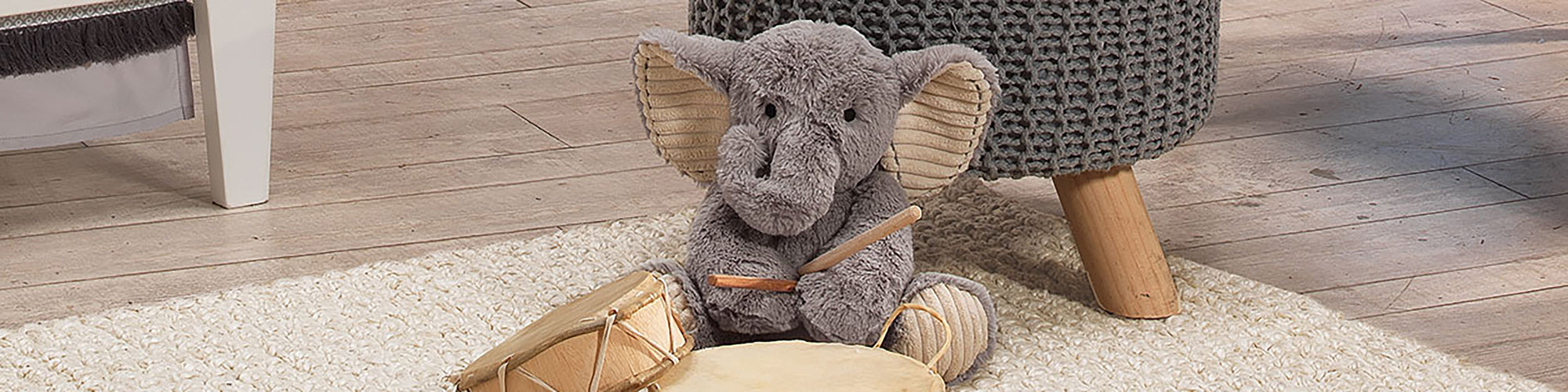 plush elephant with drum sticks