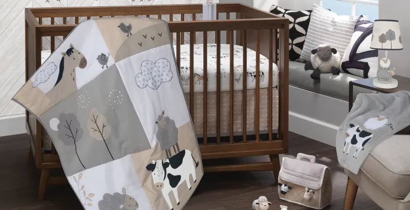 Farm-themed crib bedding set with matching quilt, sheet, and nursery accessories.